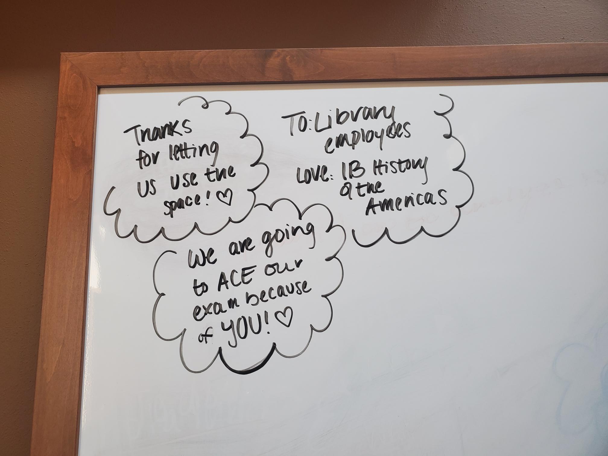 Whiteboard with "thank you" message written to librarians from students