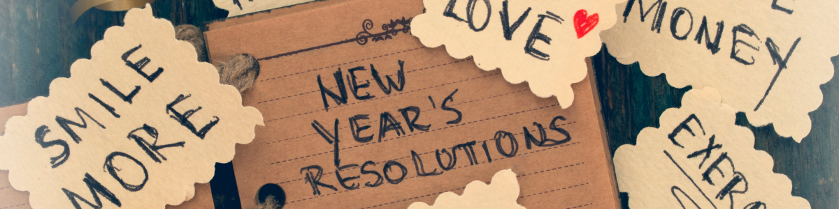 Photo of a notebook with "New Year's Resolutions" written in it.