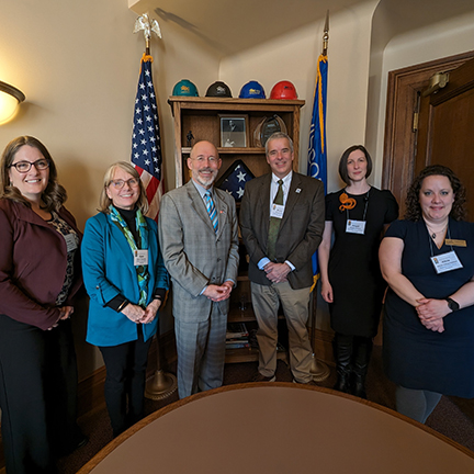 Photo of a group of library staff and supporters with Wisconsin Representative Scott Allen.