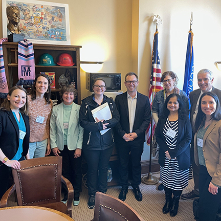 Photo of a group of library staff and supporters with Wisconsin Representative Adam Neylon.