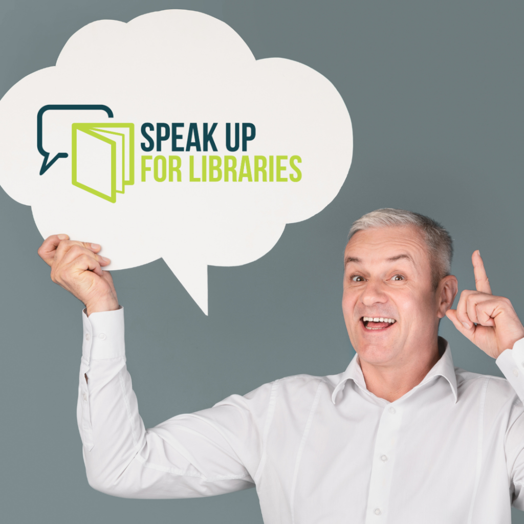 Person holding a sign in the shape of a speech bubble with the Speak Up For Libraries logo on it with a book icon overlapping a speech bubble icon.