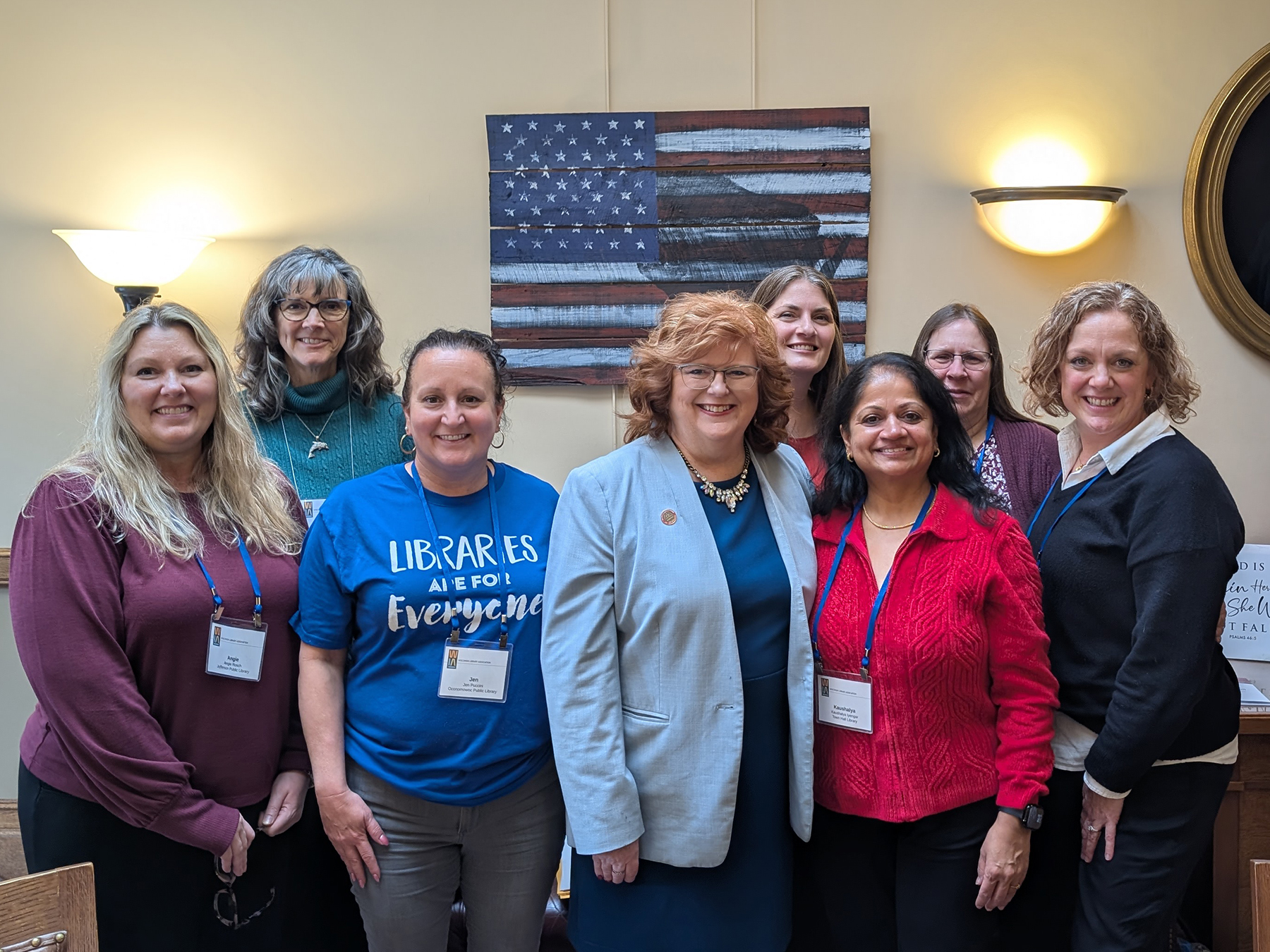 A group of library staff and trustees with Representative Barbara Dittrich inside the Wisconsin State Capitol building in Madison.