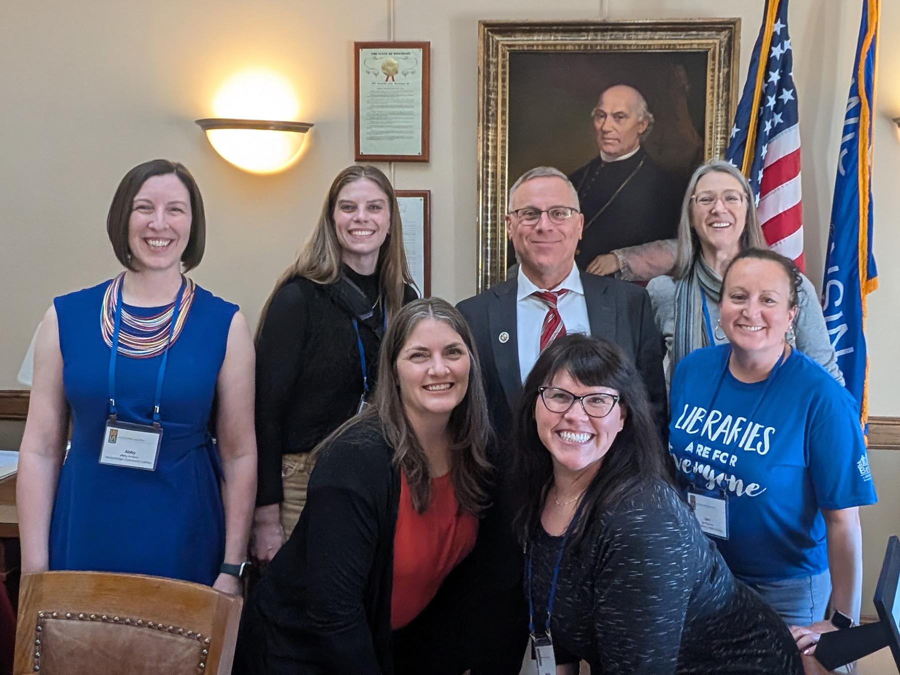A group of library staff and trustees with Representative Chuck Wichgers inside the Wisconsin State Capitol building in Madison.