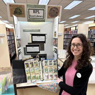 Brookfield Seed Library binder being held by a librarian