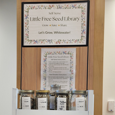 Whitewater Seed Library with jars on seeds on a shelf